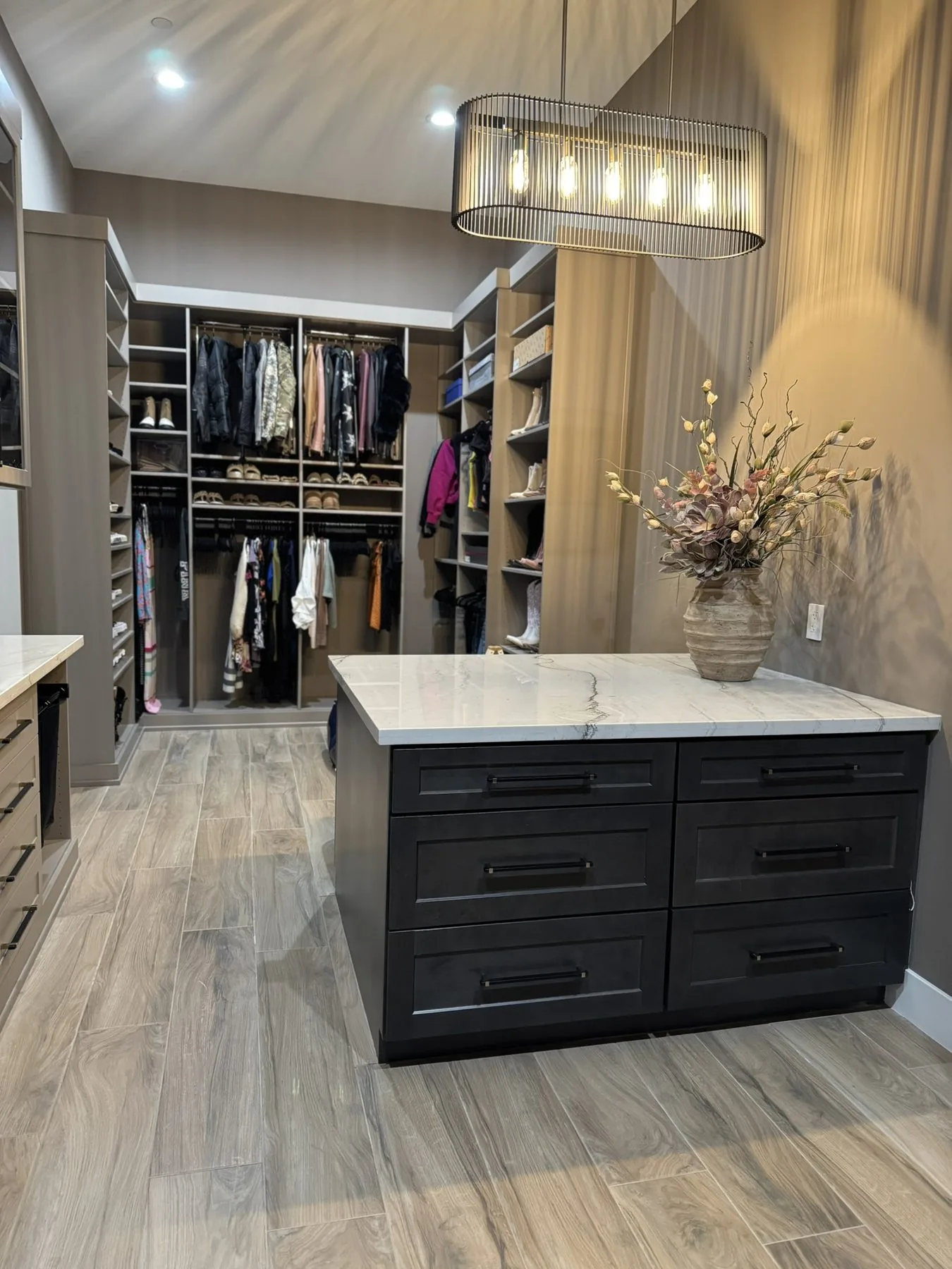 Custom walk-in closet with island storage