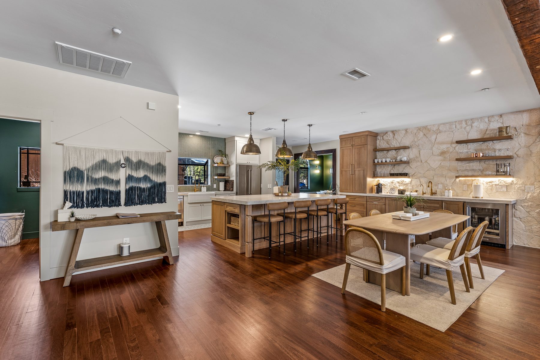 Open great room with custom kitchen and dining cabinetry