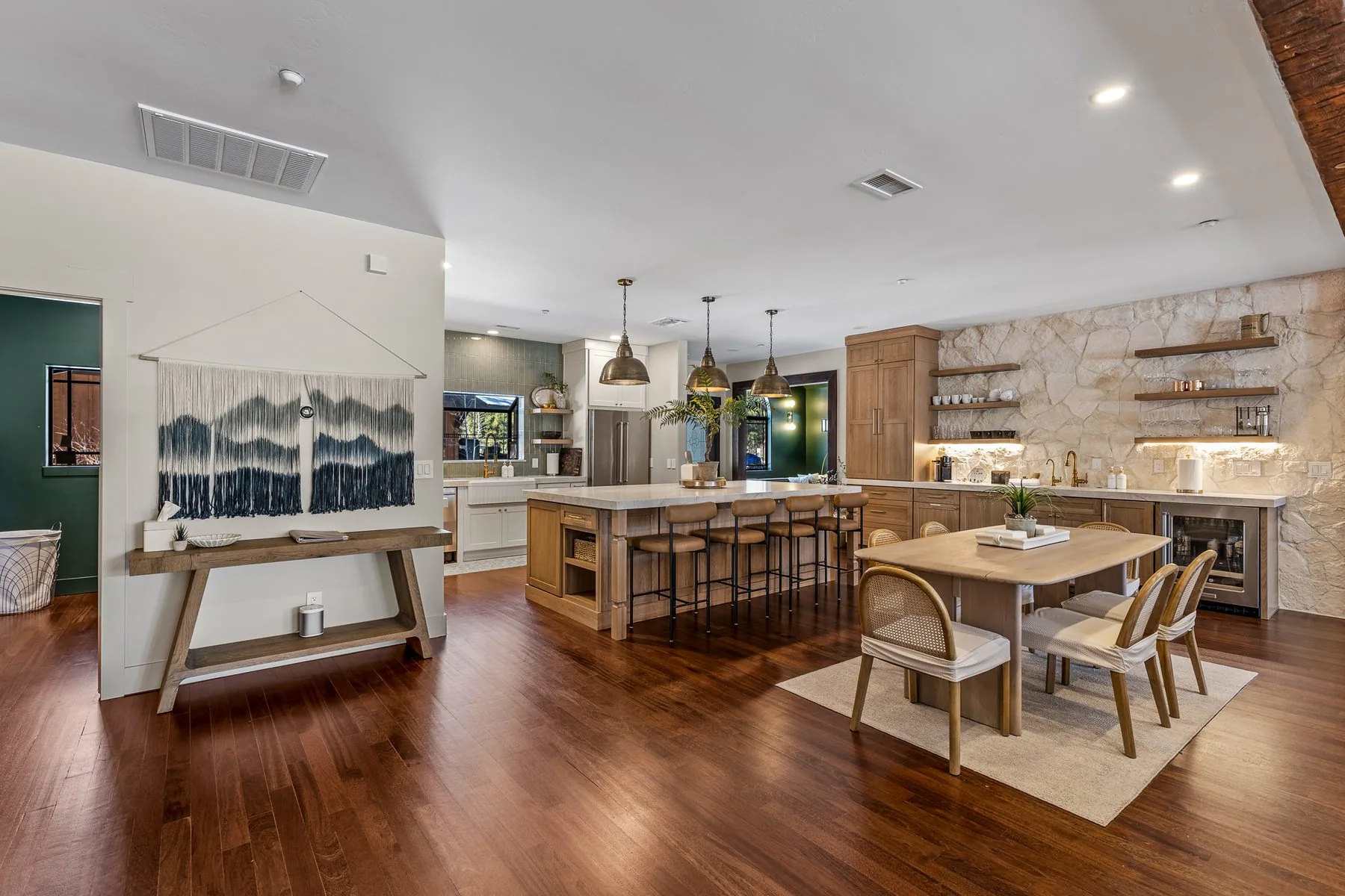 Open great room with custom kitchen and dining cabinetry