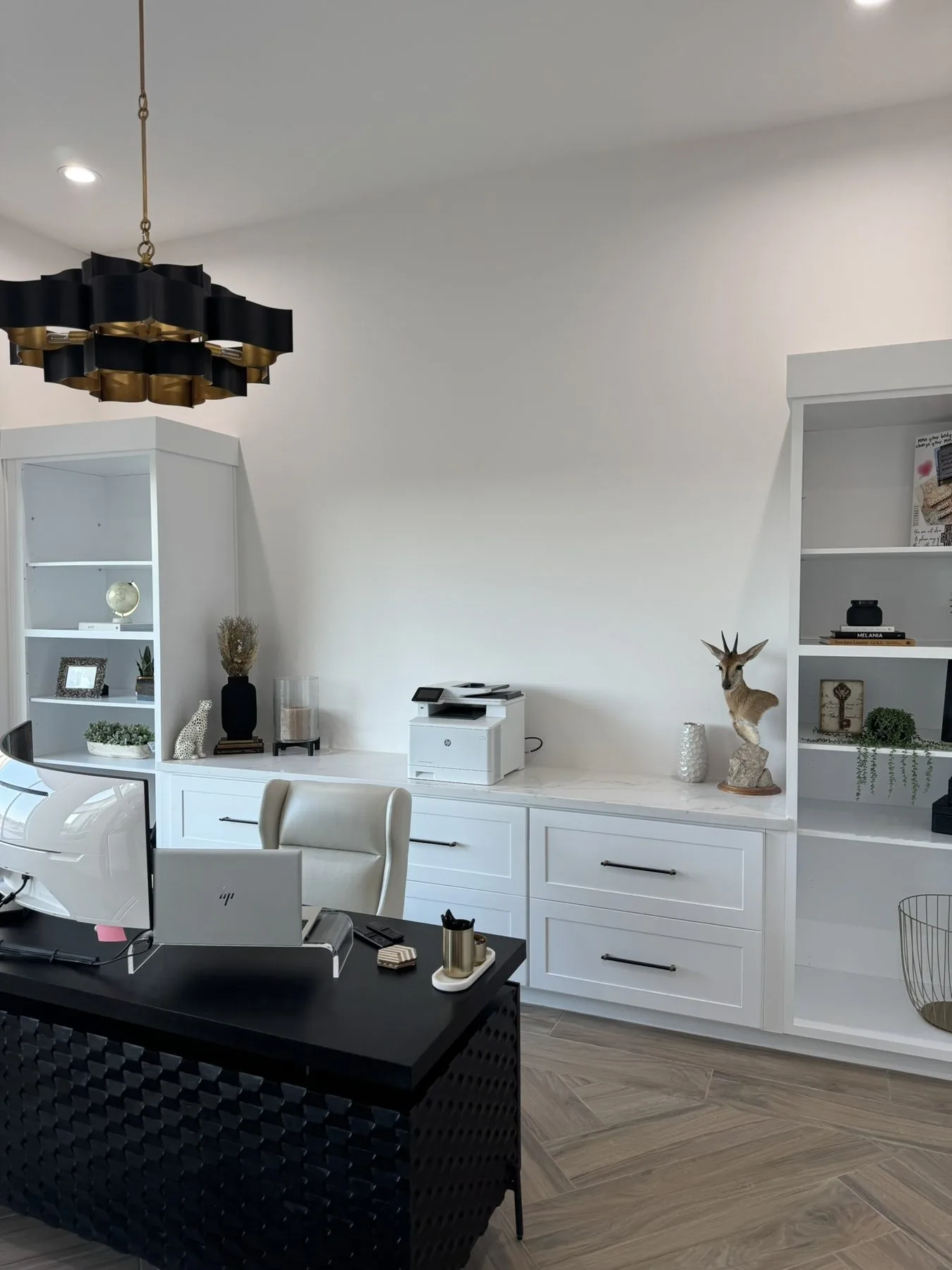 Custom built-in office cabinetry with open shelving and desk